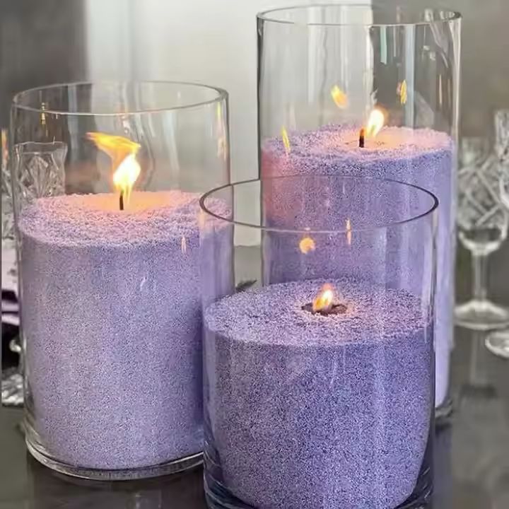 Velas con cera de arena en envase de vidrio